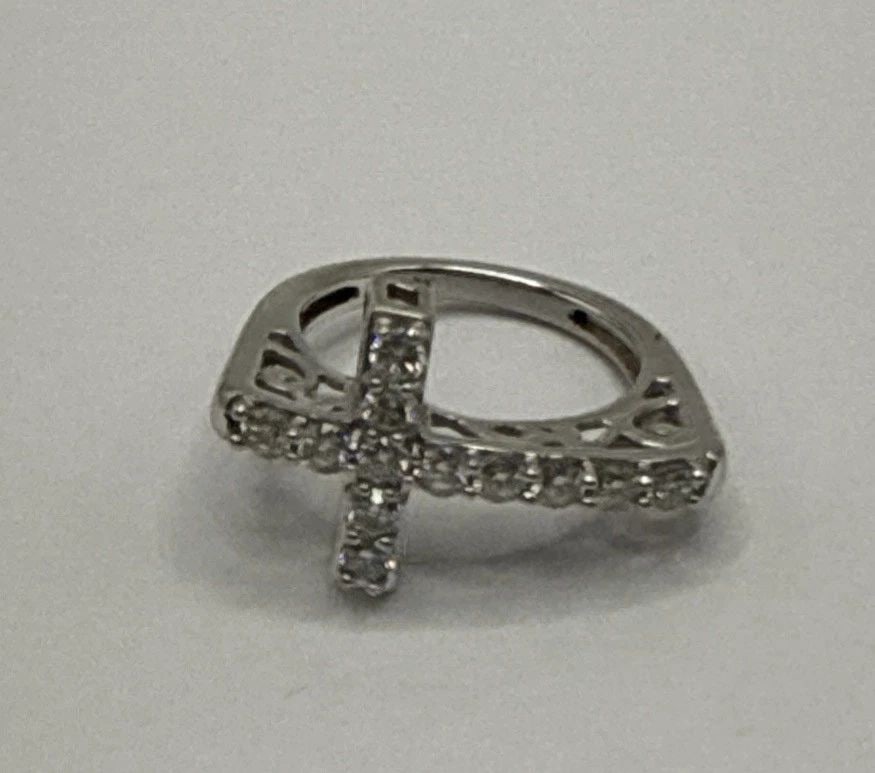 STERLING SILVER CROSS RING WITH COLORLESS STONES SIZE 6: Sterling Silver Cross Ring with Colorless Stones Size 6 This elegant Sterling Silver Cross Ring is a size 6 and features a beautiful arrangement of colorless stones. The ring is made of high-quality 9