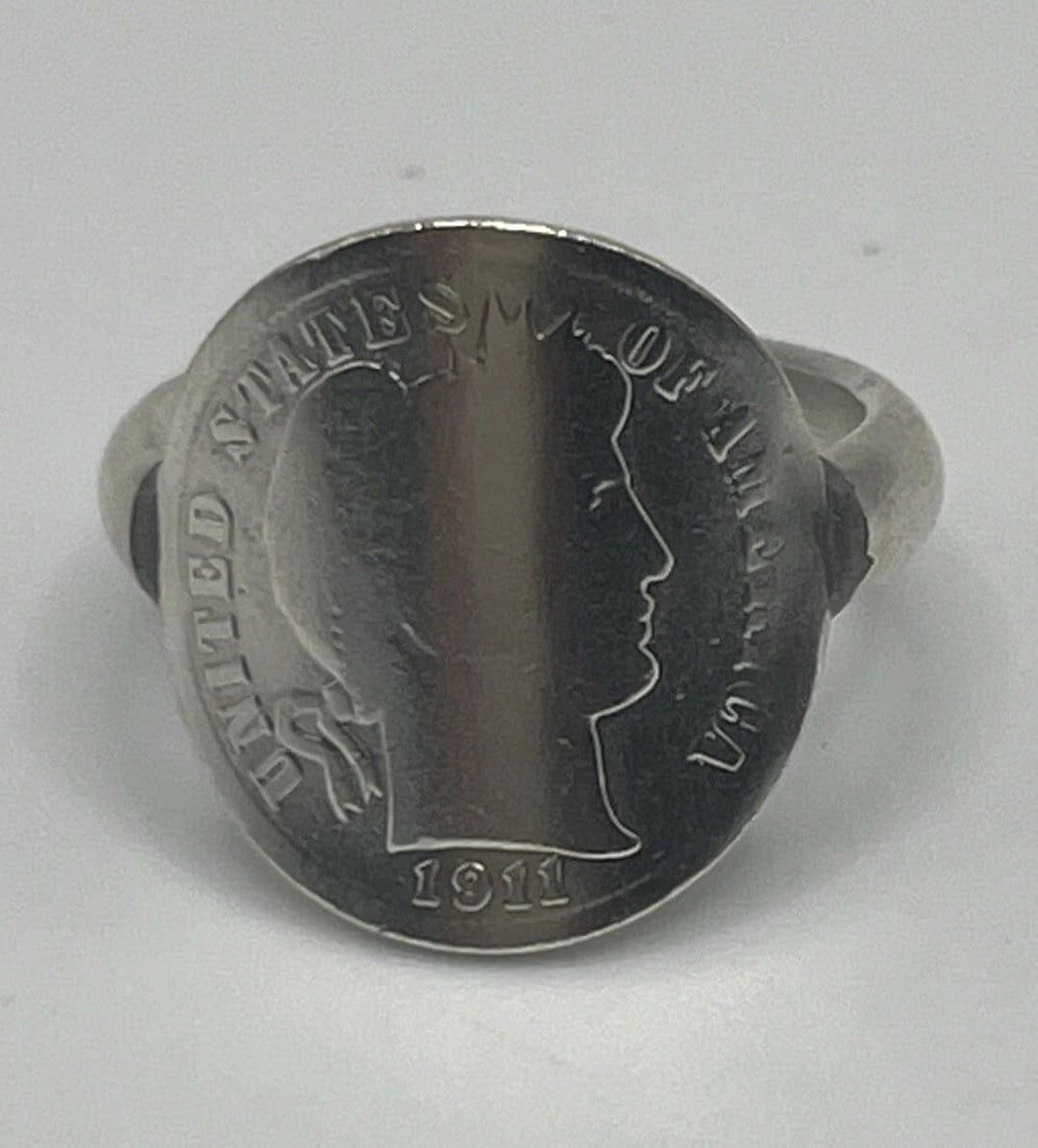 STERLING SILVER UNITED STATES OF AMERICA 1911 RING SIZE 5.75: STERLING SILVER UNITED STATES OF AMERICA 1911 RING SIZE 5.75 STERLING SILVER UNITED STATES OF AMERICA 1911 RING SIZE 5.75 This sterling silver ring is a beautiful piece of fine jewelry that would make