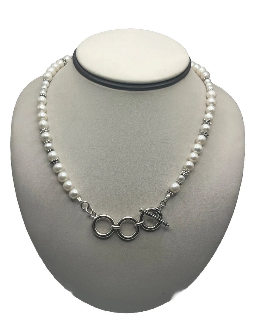 FAUX PEARL ADJUSTABLE NECKLACE: FAUX PEARL ADJUSTABLE NECKLACE FAUX PEARL ADJUSTABLE NECKLACE This Faux Pearl Adjustable Necklace is a stylish and versatile piece of fashion jewelry. The necklace features a beaded design with faux p