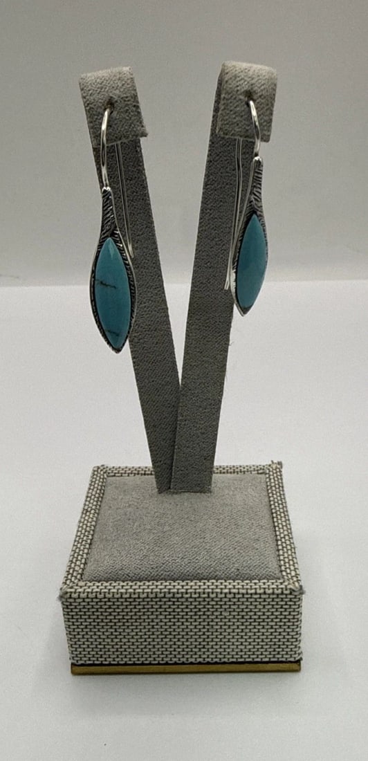 TURQUOISE AND STERLING SILVER SPEAR EARRINGS 2.6 GRAMS: TURQUOISE AND STERLING SILVER SPEAR EARRINGS 2.6 GRAMS These Turquoise and Sterling Silver Spear Earrings are a beautiful and unique piece of jewelry. The earrings feature a vibrant blue turquoise