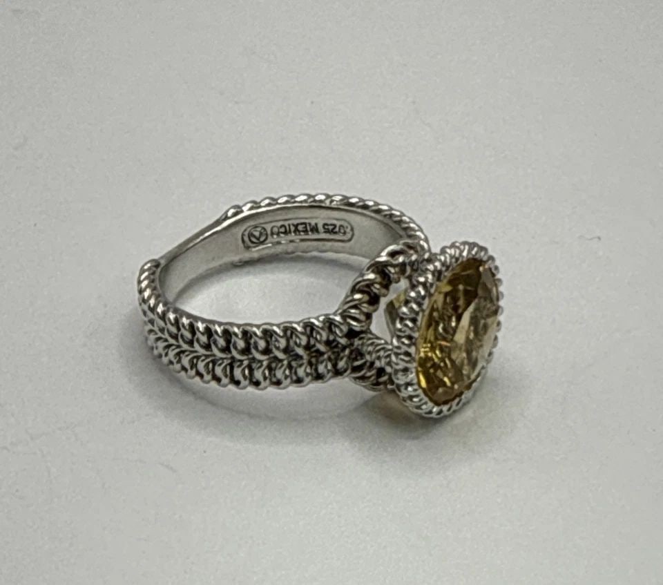 CITRINE AND STERLING SILVER SIZE 7 RING 5.0 GRAMS: CITRINE AND STERLING SILVER SIZE 7 RING 5.0 GRAMS This product is a beautiful citrine and sterling silver size 7 ring, weighing 5.0 grams. The ring features a stunning yellow citrine stone set in 925 