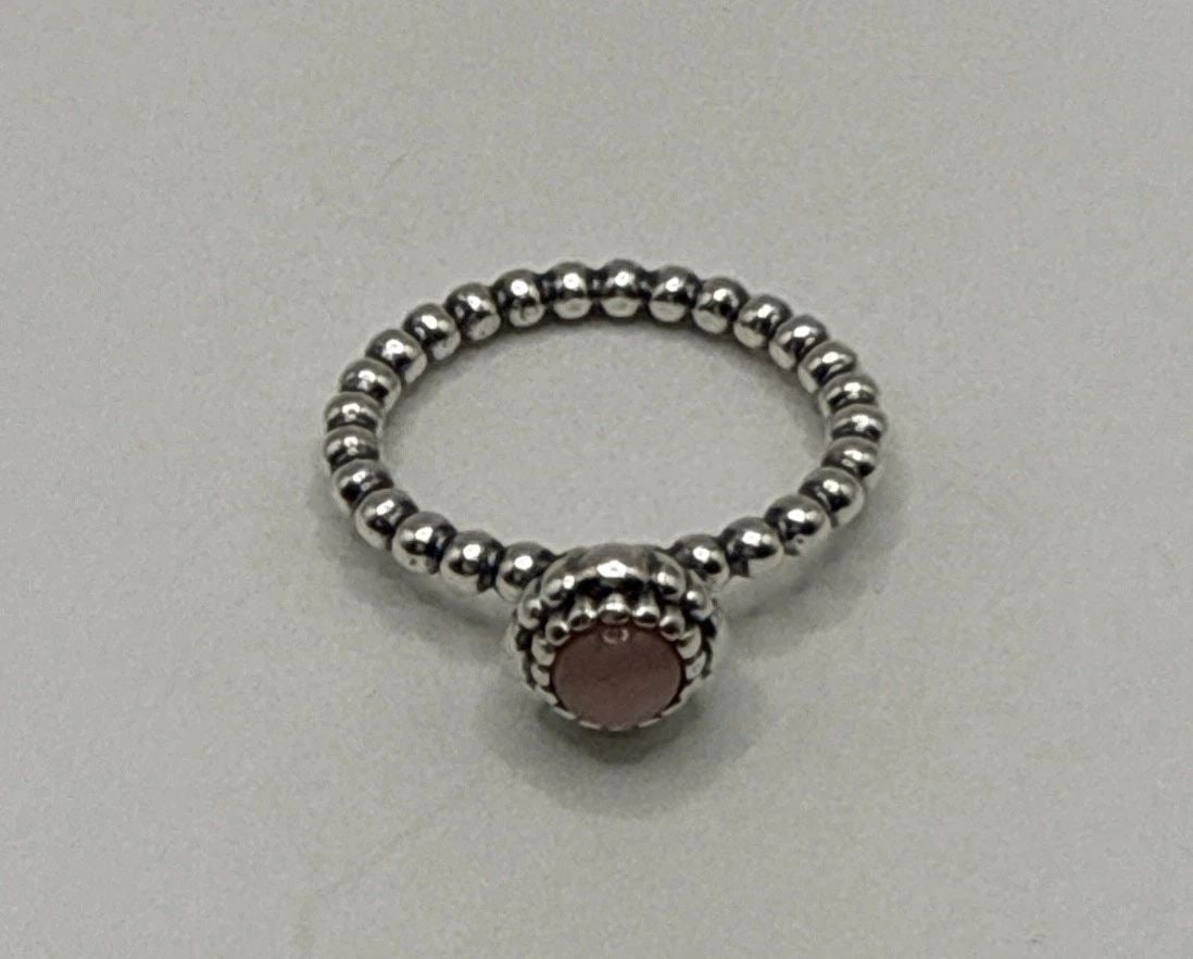 PANDORA STERLING SILVER BIRTHSTONE PINK STONE RING SIZE 6 (54): PANDORA STERLING SILVER BIRTHSTONE PINK STONE RING SIZE 6 (54) The Pandora Sterling Silver Birthstone Pink Stone Ring in size 6 is a beautiful and elegant piece of fine jewelry. Made from 925 sterling