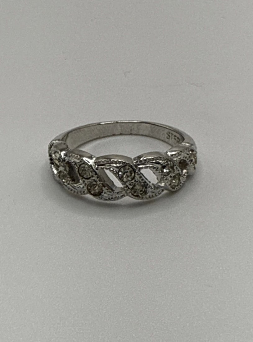 STERLING SILVER BAND RING SIZE 5: STERLING SILVER BAND RING SIZE 5 This Sterling Silver Band Ring in size 5 features a sleek design, perfect for adding a stylish touch to any outfit. Made from high-quality 925 sterling silver, this ri