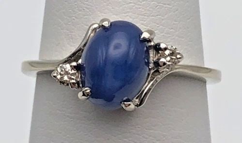 14K WHITE GOLD RING LAB-CREATED SAPPHIRE, NATURAL DIAMONDS (SIZE 6.25) 3 GRAMS: 14K WHITE GOLD RING LAB CREATED STAR SAPPHIRE AND 0.06CTS NATURAL DIAMONDS 14k White Gold Ring center synthetic Star Sapphire and 0.06cts Natural Diamonds You are bidding on a 14k White Gold Ring cent