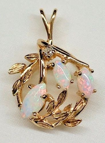14K GOLD PENDANT WITH NAVETTE CABOCHON CUT OPALS AND 0.03CT DIAMOND 3.4 GRAMS: WOMEN'S 14K PENDANT WITH NAVETTE CABOCHON CUT OPALS AND DIAMOND Women's 14K Pendant with Navette Cabochon Cut Opals and Diamond You are bidding on a pre-owned Women's 14K Pendant with Navette Cabochon