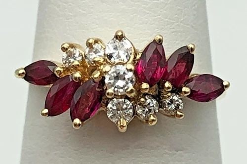 14K GOLD RING WITH NATURAL RUBIES AND 0.20CTW DIAMONDS (SIZE 6.75) 2.8 GRAM: 14K GOLD RING WITH NATURAL RUBIES AND 0.20CTS OF DIAMONDS SIZE: 6.75 14k Gold Ring with Rubies and 0.20cts of Diamonds Condition: Used, cleaned Material: 14k Yellow Gold Ring Size: 6.75 Weight: 2.8 gr