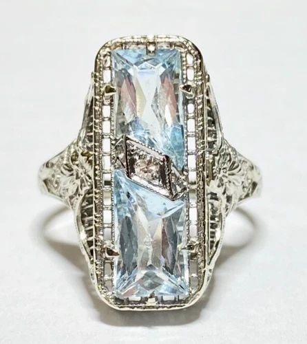 14K WHITE GOLD FILIGREE RING WITH BLUE TOPAZ AND DIAMOND (SIZE 6) 3.5 GRAMS: WOMEN'S WHITE GOLD FILIGREE RING WITH BLUE TOPAZ AND 0.02CT DIAMONDS (SIZE 6) Women's White Gold Filigree Ring with Blue Topaz and 0.02CT Diamonds (Size 6) You are bidding on a pre-owned Women's White