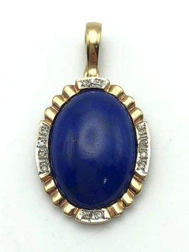 14K YELLOW GOLD PENDANT WITH BLUE LAPIS AND 0.12CTS OF DIAMONDS 3.9 GRAMS: 14K YELLOW GOLD PENDANT WITH BLUE LAPIS AND 0.12CTS OF DIAMONDS 3.9 GRAMS 14k Yellow Gold Pendant with Blue Lapis and 0.12cts of Diamonds Condition: Used Material: 14k Yellow Gold Pendant Size: 31mm x
