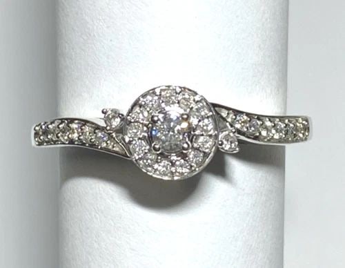NEW WOMEN'S 10K WHITE GOLD ROUND RING WITH 0.18CTW DIAMONDS (SIZE 7.5) 2.5 GRAM: WOMEN'S 10K WHITE GOLD RING WITH 0.18CT DIAMONDS (SIZE 7.5) Women's 10k White Gold Ring with 0.18CT Diamonds (Size 7.5) You are bidding on a new with tags Women's 10k White Gold Ring with 0.18CT Diamo