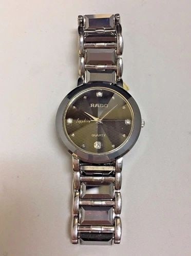 RADO SAPPHIRE QUARTZ WATCH 32MM: RADO SAPPHIRE QUARTZ WATCH RADO sapphire quartz watch You are bidding on a pre-owned RADO sapphire quartz watch. The watch is in excellent working condition. There are few minor scratches on the watch