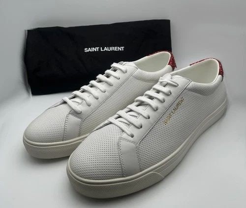 SAINT LAURENT WHITE LEATHER ANDY SNEAKERS WITH RED CRYSTAL GLITTER EU 47 US 15: SAINT LAURENT White Leather Andy Sneakers With Red Crystal Glitter Condition: ( New ) there are some light marks from being moved around in inventory, no box or papers. Comes with dust cover. PLEASE L