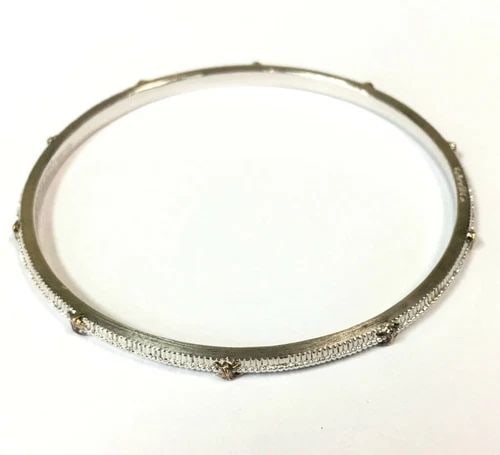GABRIEL & CO 925 STERLING SILVER BANGLE WITH 18K GOLD ACCENTS (17.1 GRAMS): GABRIEL & CO 925 STERLING SILVER BANGLE WITH 18K GOLD ACCENTS Gabriel & Co 925 Sterling Silver Bangle with 18K Gold Accents You are bidding on a pre-owned Gabriel & Co 925 Sterling Silver Bangle with 