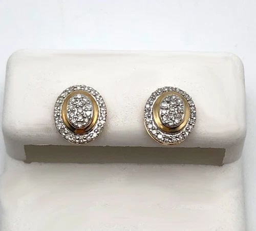 OVAL SHAPED 10K YELLOW GOLD EARRINGS WITH 0.20CTW OF DIAMONDS 1.1 GRAM: OVAL SHAPED 10K YELLOW GOLD EARRINGS WITH 0.20CTW OF DIAMONDS Oval Shaped 10k Yellow Gold Earrings with 0.20ctw of Diamonds Condition: New, no box or papers Material: 10k Yellow Gold Weight: 1.1 grams
