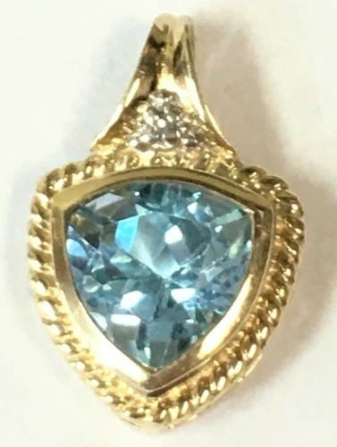 10K YELLOW GOLD PENDANT, 3.45CT TRILLION BLUE TOPAZ AND SINGLE DIAMOND 2.5G: 10K YELLOW GOLD PENDANT WITH A CENTER BLUE TOPAZ AND SINGLE DIAMOND 10k Yellow Gold Pendant with a center Blue Topaz and Single Diamond You are bidding on a 10k Yellow Gold Pendant with a center Blue 