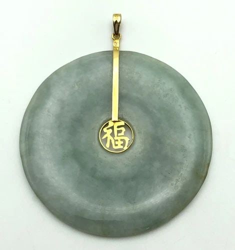 14K GOLD GREEN JADE ROUND PENDANT LARGE 51MM 16.9 GRAMS: 14K GOLD GREEN JADE ROUND PENDANT 16.9 GRAMS 14k Gold Green Jade Round Pendant Condition: Used Material: 14k Yellow Gold and jade Pendant Size: The jade circle is 51mm wide. Total Weight: 16.9 grams (