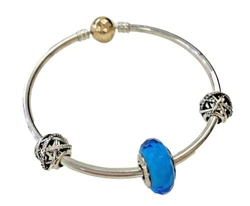 PANDORA STERLING SILVER BRACELET WITH 14K GOLD BALL CLASP ( 15.6 GRAMS ): PANDORA SILVER AND 14K GOLD BRACELET WITH LITTLE CHARMS Pandora Silver and 14k gold Bracelet with little Charms You are bidding on a pre-owned Pandora Silver and 14k gold Bracelet with little Charms. 