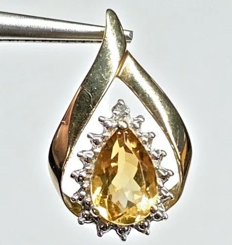 WOMEN'S 10K YELLOW GOLD PENDANT WITH GENUINE CITRINE AND DIAMOND 1.8 GRAM: WOMEN'S 10K YELLOW GOLD PENDANT WITH GENUINE CITRINE AND DIAMOND Women's 10k Yellow Gold Pendant with Genuine Citrine and Diamond You are bidding on a pre-owned Women's 10k Yellow Gold Pendant with Ge