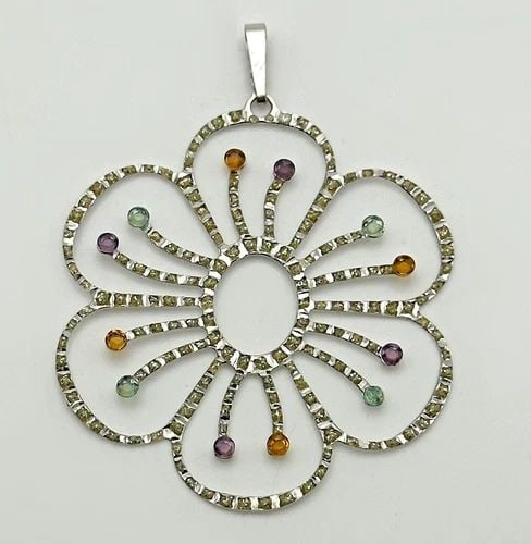 DAINTY THIN 14K WHITE GOLD FLOWER PENDANT WITH MULTI COLORED C.Z. STONES 1.6G: Dainty Thin 14k White Gold Flower Pendant with Multi Colored C.Z. Stones Condition: Used Material: 14k White Gold Pendant Size: 2 inches x 1.5 inches Total Weight: 1.6 grams Stone Info: All stones in 