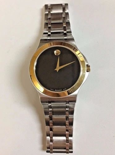 MOVADO SWISS MADE YELLOW GOLD TONE BEZEL 39MM CASE: MOVADO SWISS MADE YELLOW GOLD TONE BEZEL Mens Movado Watch You are looking at a pre owned Movado watch.The watch is in excellent working condition, has very minor scuffs and scratches on band and case