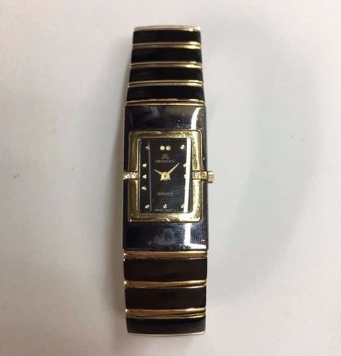 WOMEN'S GRANDJOY WATCH SWISS QUARTZ 20MM: WOMEN'S GRANDJOY QUARTZ Women's Grandjoy Quartz You are bidding on a pre-owned Women's Grandjoy Quartz watch. The watch is in excellent working condition. There are few minor scratches on the watch fr