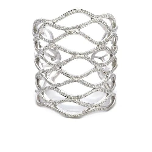 DIAMOND BRACELET 10 CARATS 18K WHITE GOLD HEAVY WAVE CUFF 2.6" WIDE 142 GRAMS: DIAMOND BRACELET 10 CARATS 18K WHITE GOLD HEAVY WAVE CUFF 2.6" WIDE 142 GRAMS This is a stunning large cuff bracelet; it is crafted from 18k white gold featuring a 2.60 inches wide band with 10 rows o