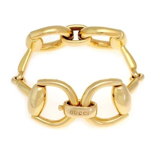 GUCCI EQUESTRIAN BRACELET LARGE HORSE BIT LINK IN 18K YELLOW GOLD: GUCCI EQUESTRIAN BRACELET LARGE HORSE BIT LINK IN 18K YELLOW GOLD This is a gorgeous authentic chic bracelet by Gucci, it is crafted from 18k yellow gold with a fine polished finish featuring 4 large 
