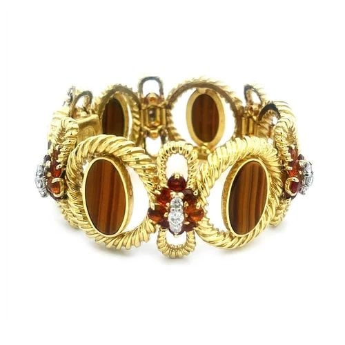 LA TRIOMPHE DIAMOND BRACELET CITRINE TIGER'S EYE CABLE OVAL BOW LINKS: LA TRIOMPHE DIAMOND BRACELET CITRINE TIGER'S EYE CABLE OVAL BOW LINKS This is a gorgeous authentic bracelet by La Triomphe, it is crafted from 18k yellow gold featuring alternating thick grooved wire 