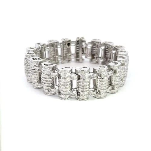 DIAMOND 15CT MEN'S BRACELET BAGUETTE SET LONG BARREL LINKS 10K GOLD: DIAMOND 15CT MEN'S BRACELET BAGUETTE SET LONG BARREL LINKS 10K GOLD This is a bold men's bracelet, it is crafted from 10k white gold featuring 22mm long barrel shape links with multi-rows of channel s