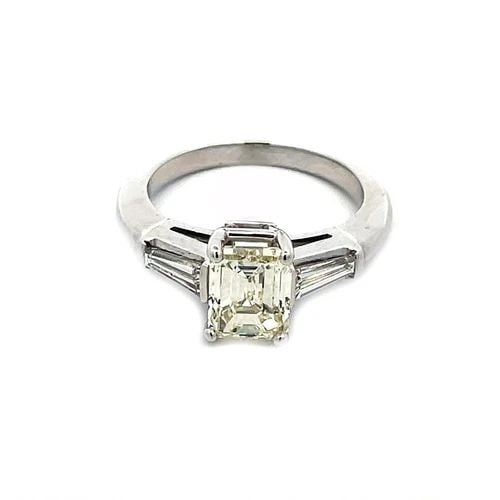 EMERALD CUT ENGAGEMENT RING 1.85CT DIAMOND PLATINUM W/ACCENT: EMERALD CUT ENGAGEMENT RING 1.85CT DIAMOND PLATINUM W/ACCENT This stunning engagement ring is crafted from platinum featuring an emerald cut 1.85 carat diamond set in the center and is held securely i