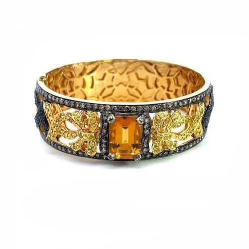 GILBERT ALBERT DIAMOND GOLD BRACELET 18K YELLOW SILVER GEMSTONES RIBBON BOW: GILBERT ALBERT DIAMOND GOLD BRACELET 18K YELLOW SILVER GEMSTONES RIBBON BOW This is a gorgeous authentic bracelet by Swiss designer Gilbert Albert, it is crafted from 18k yellow gold with darkened sil