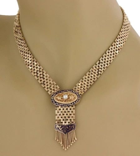 14K ENAMEL PEARL NECKLACE OVAL TASSEL PENDANT WIDE IN YELLOW GOLD: 14K ENAMEL PEARL NECKLACE OVAL TASSEL PENDANT WIDE IN YELLOW GOLD This lovely oval and tassel pendant necklace is crafted from 14k yellow gold featuring a 10.5mm Criss cross link necklace with slide c