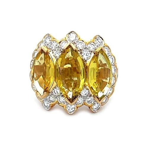 LOVELY YELLOW SAPPHIRE & DIAMOND 18K YELLOW GOLD COCKTAIL RING: LOVELY YELLOW SAPPHIRE & DIAMOND 18K YELLOW GOLD COCKTAIL RING This is a stunning cocktail ring, from 18k yellow gold in a fine polished finish. It is exquisitely crafted in 18k yellow gold with a smo