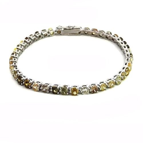 DIAMONDS TENNIS BRACELET MULTICOLOR NATURAL COLOR ROUND OVAL AND CUSHION 8CT: DIAMONDS TENNIS BRACELET MULTICOLOR NATURAL COLOR ROUND OVAL AND CUSHION 8CT This lovely tennis bracelet is crafted from 14k white gold featuring colored oval cushion and round cut diamonds with white