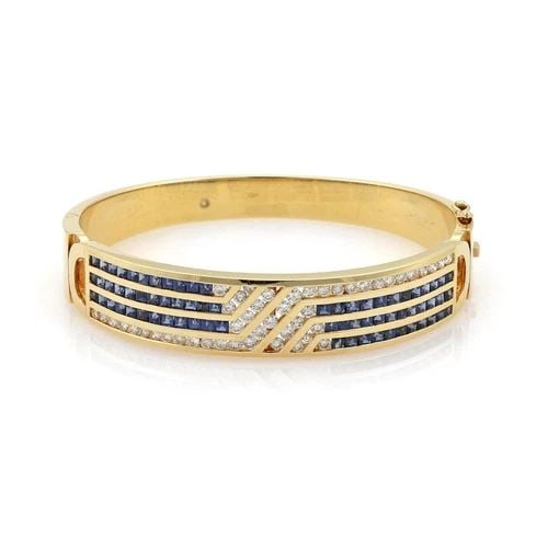 ESTATE 7 CARATS DIAMOND & SAPPHIRE 18K YELLOW GOLD WIDE BRACELET LIQUIDATION: ESTATE 7 CARATS DIAMOND & SAPPHIRE 18K YELLOW GOLD WIDE BRACELET Estate 7 Carats Diamond & Sapphire 18k Yellow Gold Wide Bracelet Description This is an elegant yellow gold, diamonds and blue sapphire