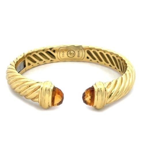 DAVID YURMAN GOLD CUFF BRACELET CITRINE CABLE KICK STYLE: DAVID YURMAN GOLD CUFF BRACELET CITRINE CABLE KICK STYLE This authentic David Yurman bracelet is from the Classic Cable Collection in the cuff style. It is crafted from 18k yellow gold with a polished