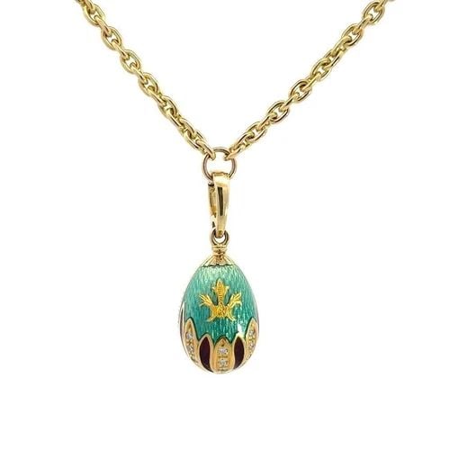 FABERGE DIAMOND EGG PENDANT NECKLACE 18K YELLOW GOLD GUILLOCHE ENAMEL: FABERGE DIAMOND EGG PENDANT NECKLACE 18K YELLOW GOLD GUILLOCHE ENAMEL This is an authentic Faberge egg pendant and chain necklace. It is crafted from 18k yellow gold with a polished finish. The pendan