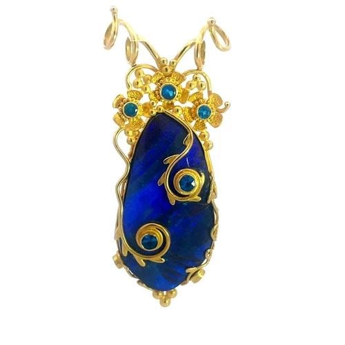 CAROLYN TYLER 22K GOLD PENDANT YELLOW BLUE GEMSTONE FLORAL STYLE: CAROLYN TYLER 22K GOLD PENDANT YELLOW BLUE GEMSTONE FLORAL STYLE The Carolyn Tyler 22k Gold Pendant features a long shape with floral design in 22k yellow gold yellow and inside the frame is a long sh