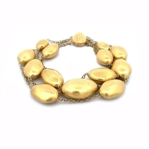 MARCO BICEGO 18K BRACELET SIVIGLIA 3 STRAND 18K YELLOW GOLD OVAL BEADS: MARCO BICEGO 18K BRACELET SIVIGLIA 3 STRAND 18K YELLOW GOLD OVAL BEADS From the Siviglia Collection by Marco Bicego, this chic fashionable bracelet is crafted from 18k yellow gold featuring 3 strand o
