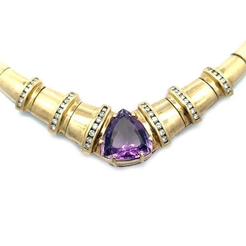 DIAMOND GOLD AMETHYST NECKLACE 14K YELLOW COLLAR STYLE: DIAMOND GOLD AMETHYST NECKLACE 14K YELLOW COLLAR STYLE The diamond and 14k yellow gold necklace is a stunning piece of fine jewelry featuring a pear-shaped pendant with a large prong set amethyst gems