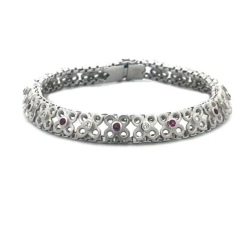 GARAVELLI GOLD DIAMOND BRACELET 18K WHITE GEMSTONE FLORAL STYLE: GARAVELLI GOLD DIAMOND BRACELET 18K WHITE GEMSTONE FLORAL STYLE This is a charming Garavelli bracelet, it features a beautiful fine textured floral link in 18k white gold with alternating bezel set di