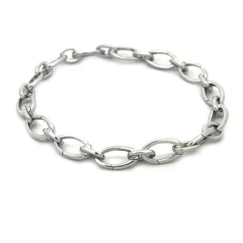 TIFFANY & CO. CLASPING LINK GOLD BRACELET 18K WHITE MARQUISE SHAPE CHAIN: TIFFANY & CO. CLASPING LINK GOLD BRACELET 18K WHITE MARQUISE SHAPE CHAIN This Tiffany & Co. Clasping Link Gold Bracelet is a classic piece of fine jewelry made of 18K white gold. It features alternati