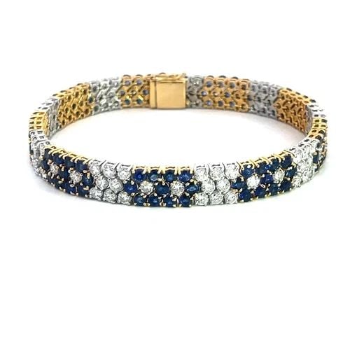 DIAMOND SAPPHIRE GOLD BRACELET 18K TWO TONE FLORAL WIDE FLEX LINK STYLE: This gorgeous diamond sapphire gold bracelet is a stunning piece of fine jewelry featuring a wide flex link style with a floral design. Made with natural white diamonds and sapphires set in 18k yellow