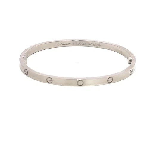 CARTIER LOVE GOLD BANGLE SMALL MODEL 18K WHITE SIZE 16 BOX & PAPER: CARTIER LOVE GOLD BANGLE SMALL MODEL 18K WHITE SIZE 16 BOX & PAPER This elegant bangle is by Cartier, from 18k white gold, it features a screw closure and signed by the brand. This small model bangle,