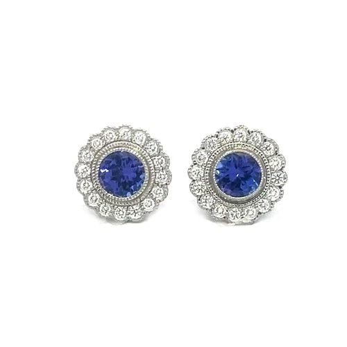 TIFFANY & CO. SOLESTE TANZANITE EARRINGS PLATINUM DIAMOND STUD HALO STYLE: TIFFANY & CO. SOLESTE TANZANITE EARRINGS PLATINUM DIAMOND STUD HALO STYLE These gorgeous earrings belong to the Tiffany Soleste Collection. They are platinum and is inspired by the warmth and energy o