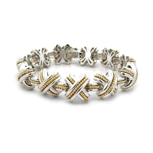 TIFFANY & CO. SIGNATURE X BRACELET STERLING SILVER 18K YELLOW GOLD 1990: TIFFANY & CO. SIGNATURE X BRACELET STERLING SILVER 18K YELLOW GOLD 1990 From the Signature X Collection by Tiffany & Co; this eye-catching bracelet is well crafted from sterling silver with 18k yellow
