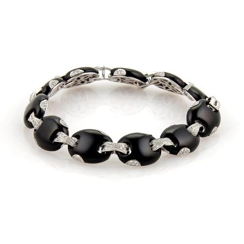 DIAMONDS ONYX 14K BRACELET WHITE GOLD OVAL & CROSSOVER LINK 1.32CT: DIAMONDS ONYX 14K BRACELET WHITE GOLD OVAL & CROSSOVER LINK 1.32CT Oval & Crossover Link 1.32ct Diamonds Onyx 14k White Gold Bracelet Description This is a lovely late 1990s bracelet. It is crafted fr
