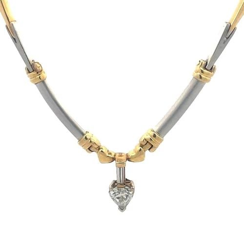 HEART DIAMOND GOLD PENDANT 14K TWO TONE BONE LINK NECKLACE: HEART DIAMOND GOLD PENDANT 14K TWO TONE BONE LINK NECKLACE This lovely necklace is crafted from 14k yellow and white gold. The pendant features a heart shaped frame with a heart cut diamond accented o