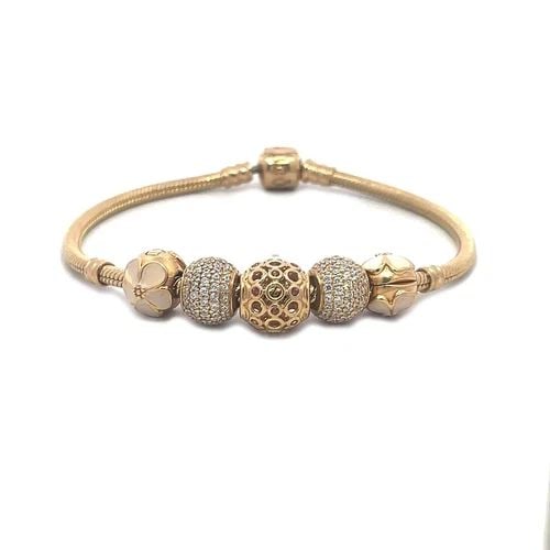 PANDORA ENAMEL GOLD BRACELET 14K YELLOW 5 CHARMS SNAKE CHAIN: PANDORA ENAMEL GOLD BRACELET 14K YELLOW 5 CHARMS SNAKE CHAIN This is an authentic bracelet by Pandora, it is crafted from 14k yellow gold featuring a 3mm thick snake chain band with 5 slide charms, tw