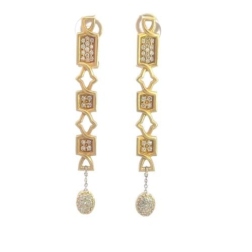 FIBULA DIAMOND GOLD EARRINGS 18K YELLOW LONG DANGLE STYLE: FIBULA DIAMOND GOLD EARRINGS 18K YELLOW LONG DANGLE STYLE Elevate your jewelry collection with the exquisite Fibula Diamond Gold Earrings, crafted in 18k yellow gold and featuring a stunning pavéd di
