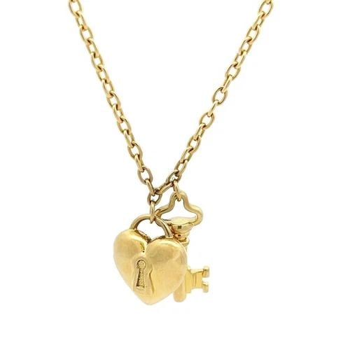 TIFFANY & CO.18K YELLOW GOLD PUFF HEART LOCK & KEY PENDANT NECKLACE: TIFFANY & CO.18K YELLOW GOLD PUFF HEART LOCK & KEY PENDANT NECKLACE This is an authentic Tiffany & Co. necklace; it is crafted in 18k yellow gold with a fine polished finish. The pendant is in the des